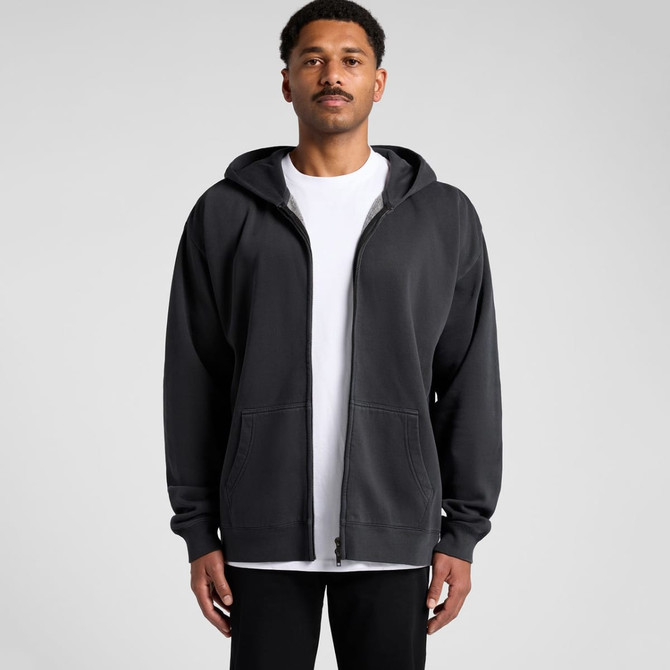A person wearing a black zip-up hoodie with a front zip and an attached hood, featuring a logo.