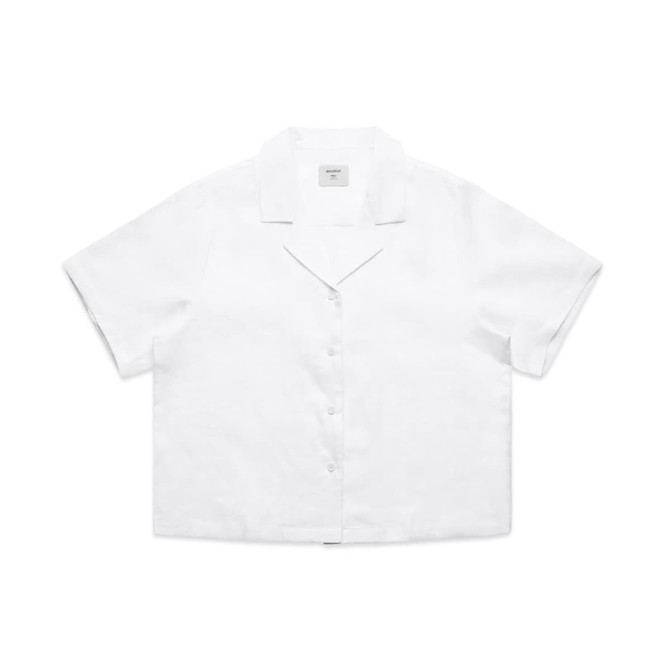 A white short-sleeve button-up shirt made of linen with a collar and a logo.