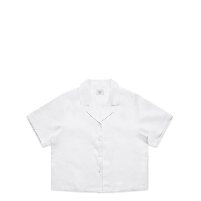 A white button-up shirt with short sleeves and a collar, featuring a logo on the label.