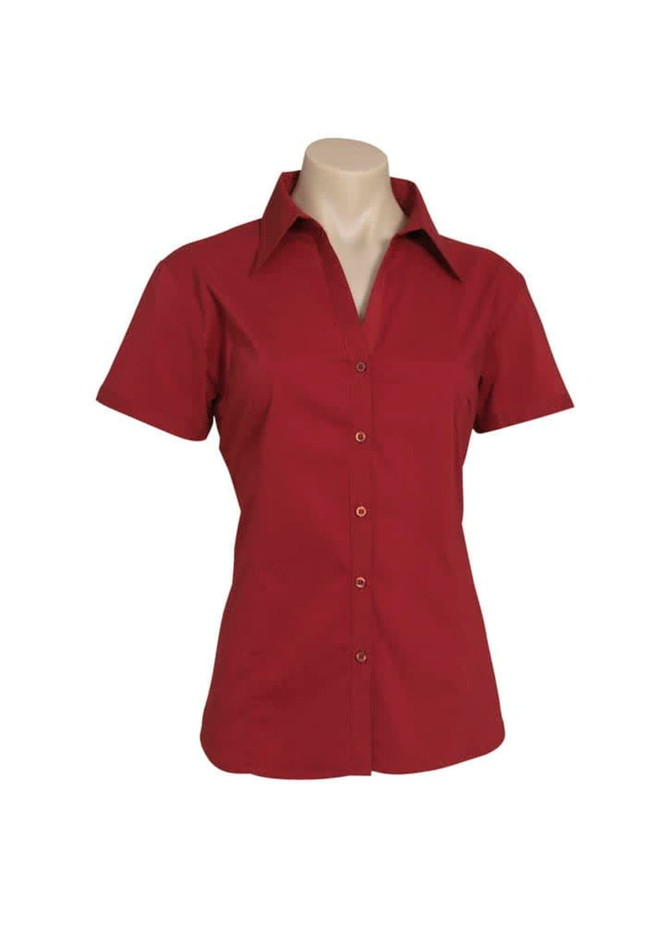 A red women's short sleeve button-up shirt displayed on a mannequin with a collar and buttons.