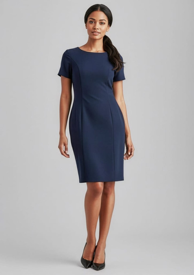 A fitted navy short sleeve shift dress on a model, featuring a classic round neckline and a sleek design.