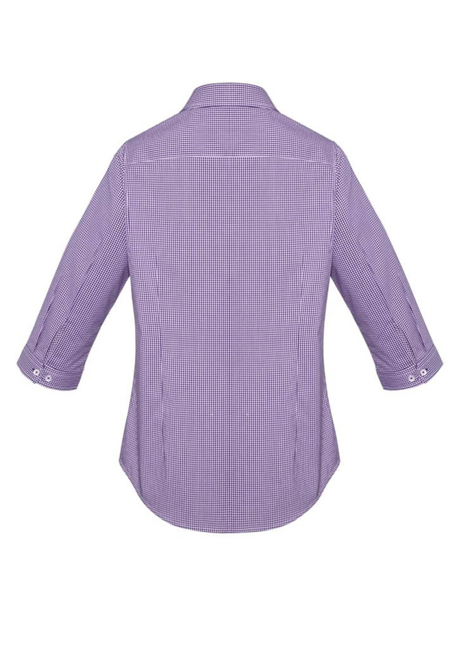A women's purple checkered button-up shirt with 3/4 sleeves and a curved hem, featuring a logo.