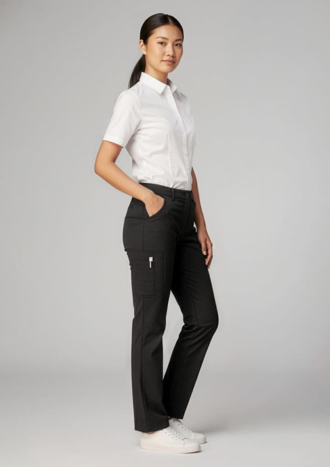 A model wearing black women's comfort waist cargo pants with a white shirt and sneakers, featuring pockets and a logo.