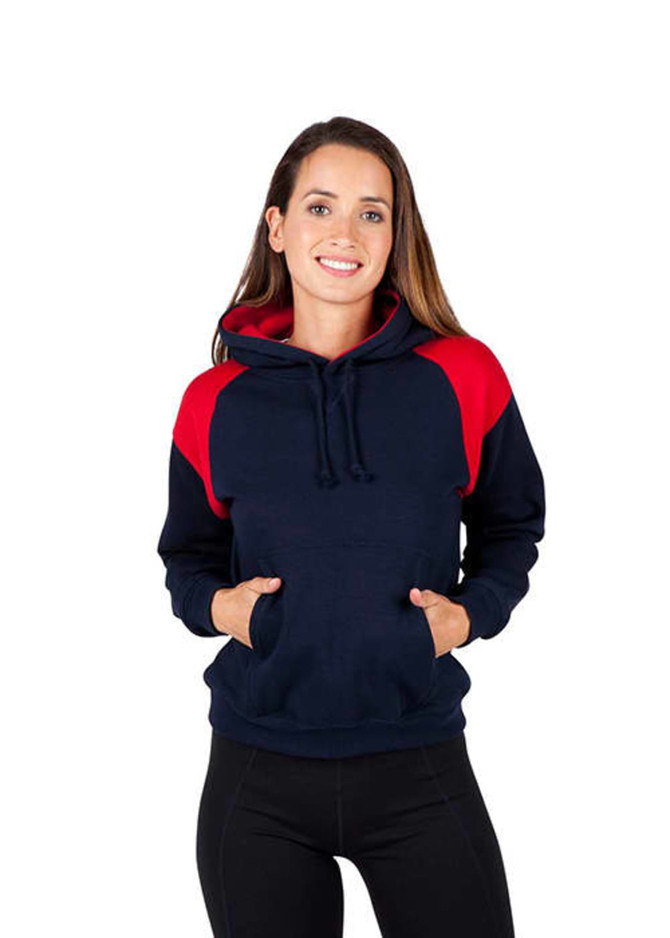 A woman wearing a navy and red shoulder contrast panel hoodie with a pocket and hood. The hoodie has a logo.