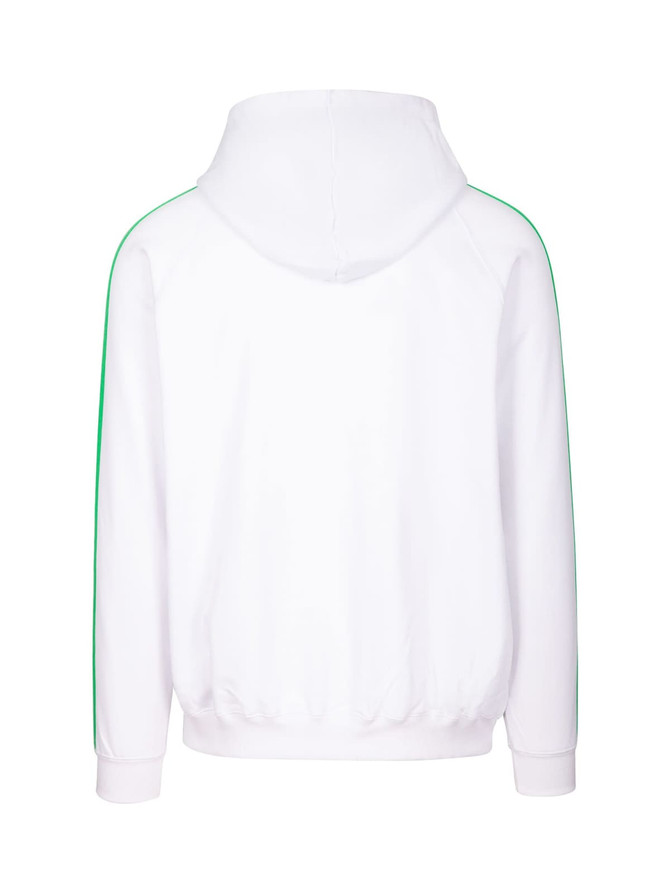 A hoodie in white with green stripe detailing along the sleeves and a drawstring hood. Features a logo.