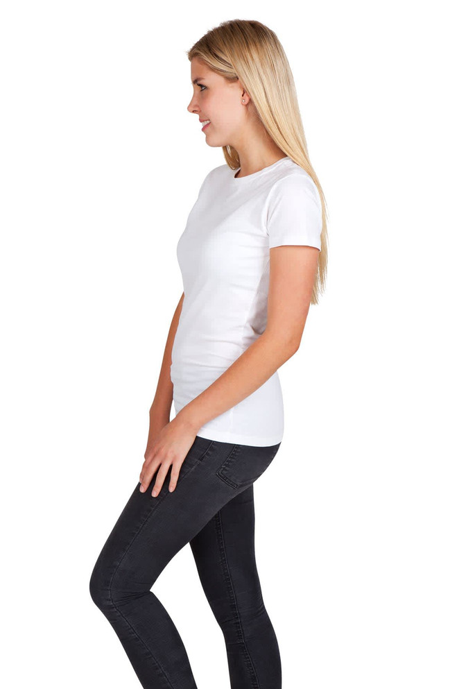 A women's modern fit T-shirt in white, paired with black leggings, displayed on a model from the side.