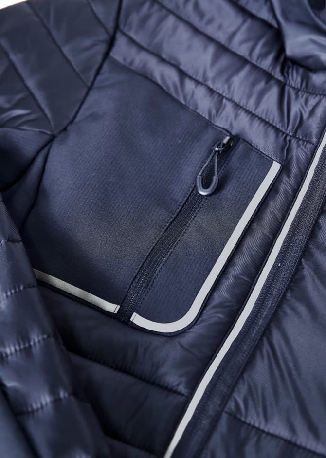 A navy unisex patrol jacket featuring a zippered chest pocket and quilted design. Logos are visible on the jacket.