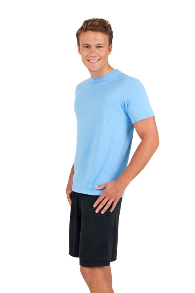 A light blue unisex t-shirt displayed on a model, paired with black shorts and featuring a logo.