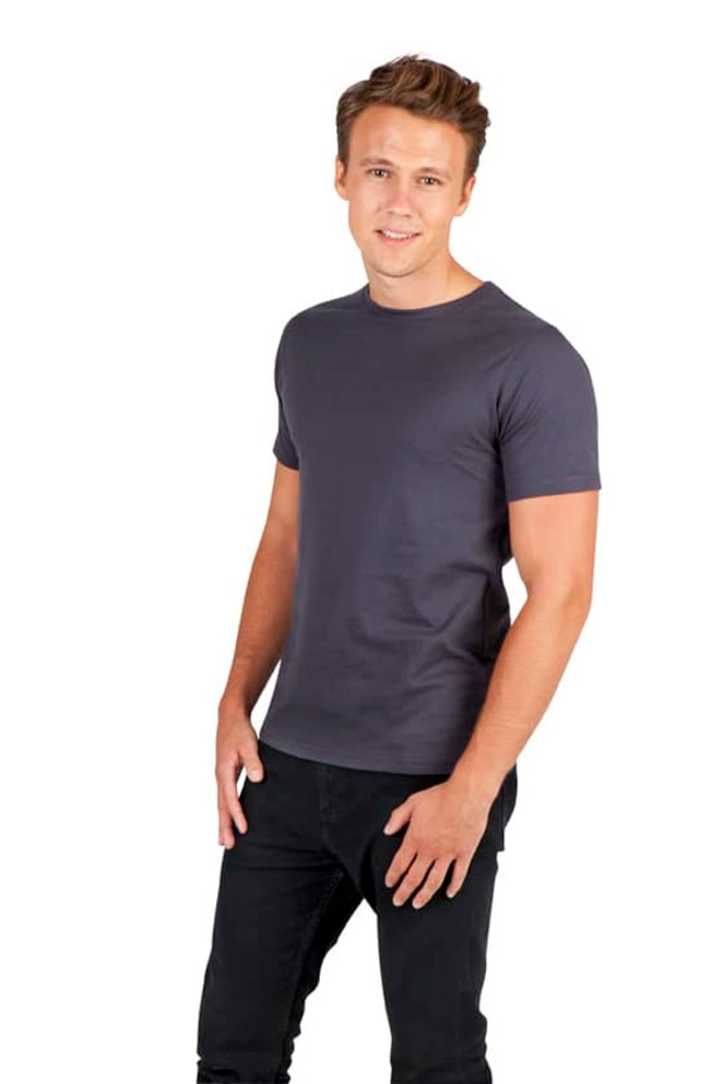 A man poses in a grey men's slim fit T-shirt, paired with black jeans, against a plain white background.