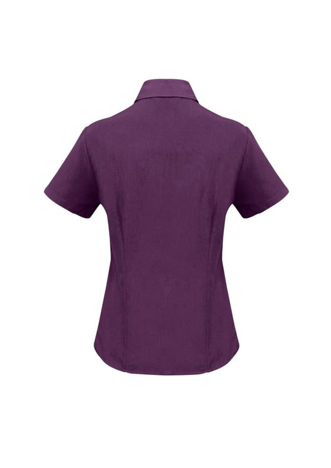 A purple short sleeve button-up shirt with a collar and a logo on the back.