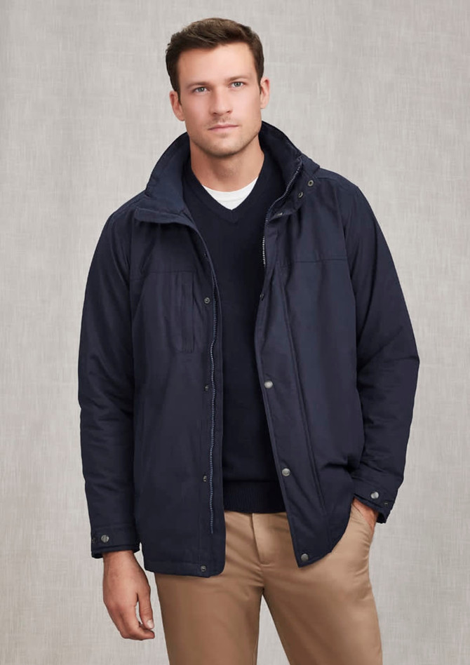 A navy men's comfort jacket with a hood, featuring a front zip and snap closure, and a logo on the chest.