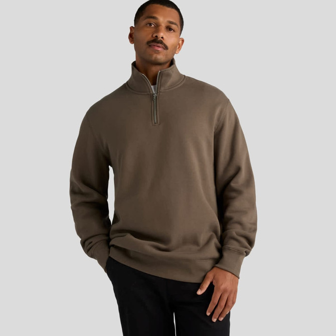 A grey-brown half zip crew jumper with a relaxed fit and a logo displayed.