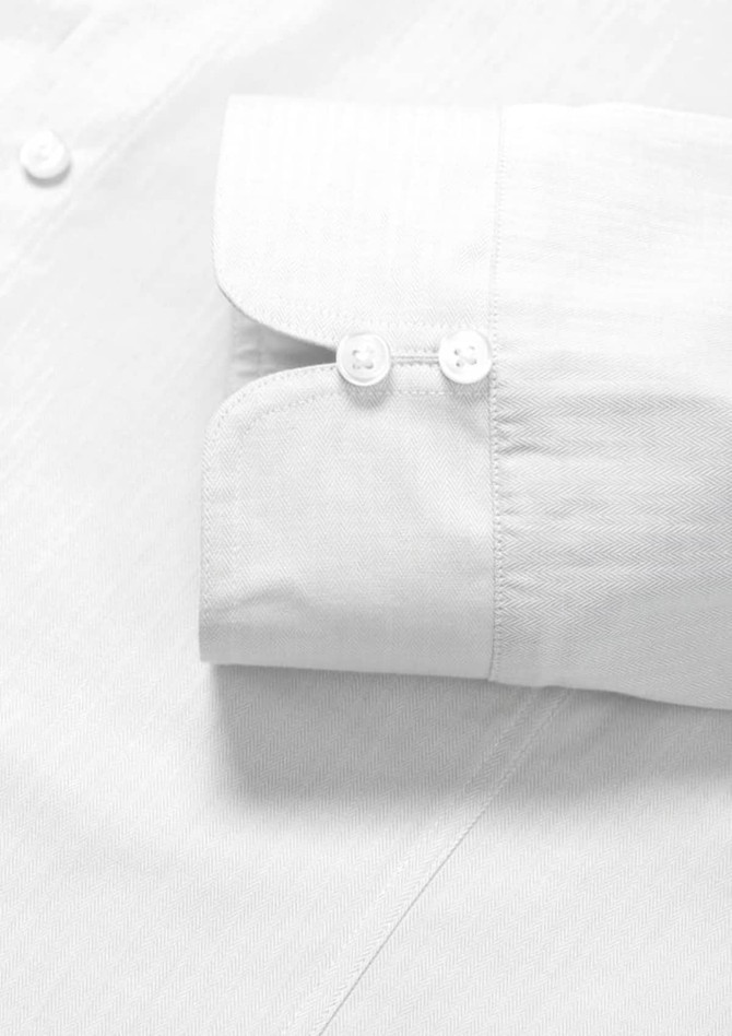 A white button-up shirt with long sleeves, featuring double cuffs and two buttons on the cuff.