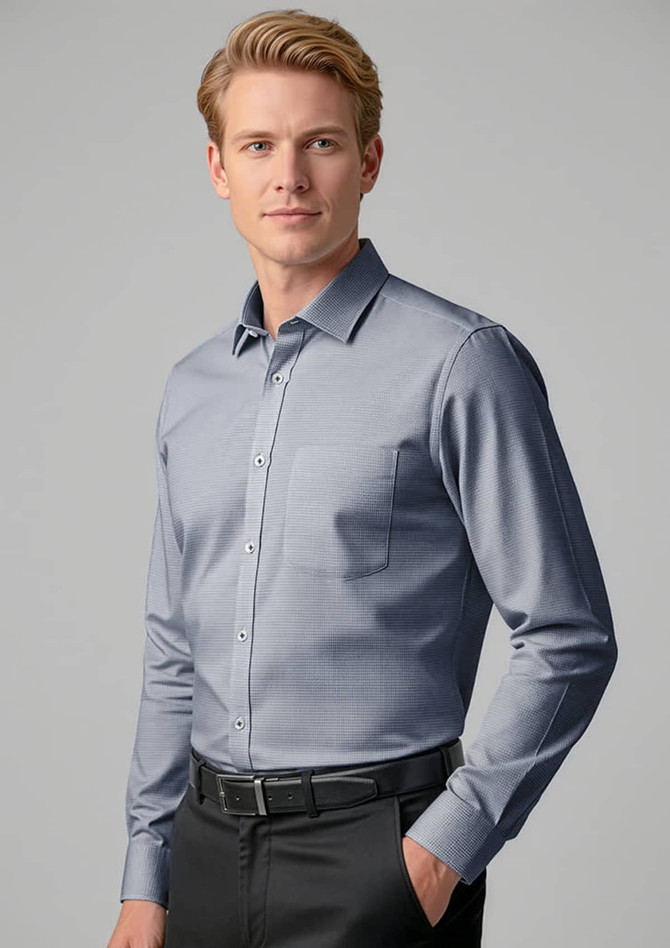 A men's long sleeve button-up shirt in light blue, featuring a single chest pocket and a subtle pattern.