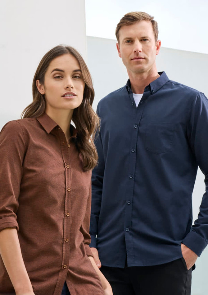 A brown long sleeve button-up shirt and a navy long sleeve button-up shirt on models, featuring a logo on one shirt.