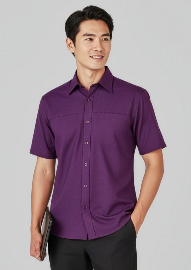 A plain short sleeve shirt in purple, featuring a button-up design and a branded logo. Perfect for smart casual wear.
