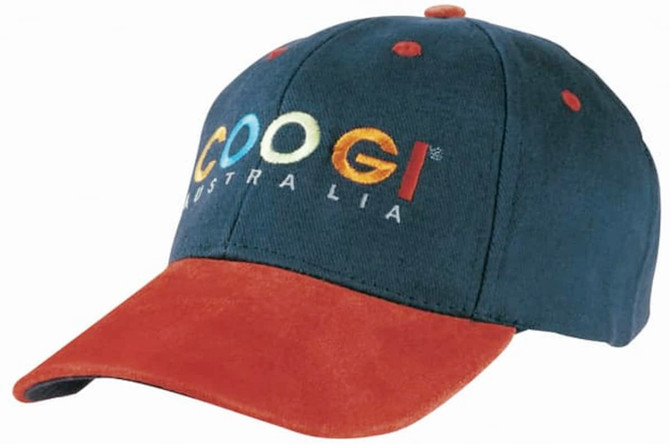 A navy cap with a suede peak in rust, featuring a logo on the front.