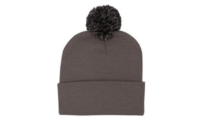 Acrylic beanie in grey with a fluffy pom pom on top, featuring a folded brim and a logo.