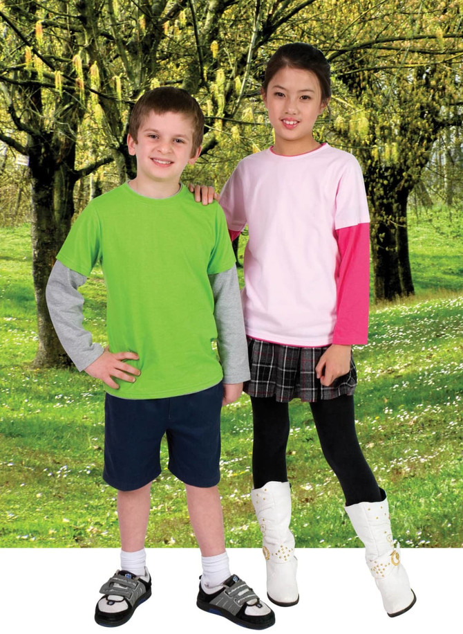 A green and grey long-sleeve t-shirt worn by a boy, and a pink and grey long-sleeve t-shirt worn by a girl, set in a grassy landscape.