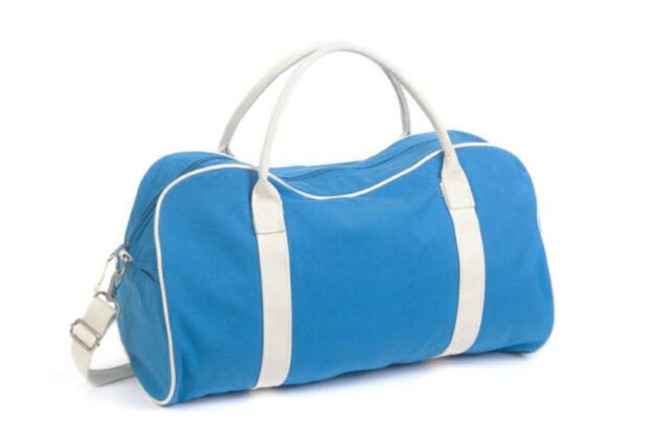 A blue bag with white trim and handles, featuring a shoulder strap. It has a logo on the side. A blue bag with white trim and handles, featuring a shoulder strap. It has a logo on the side.