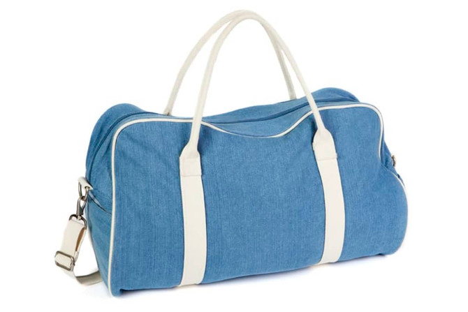 A blue denim bag with white detailing and handles, featuring a detachable shoulder strap.