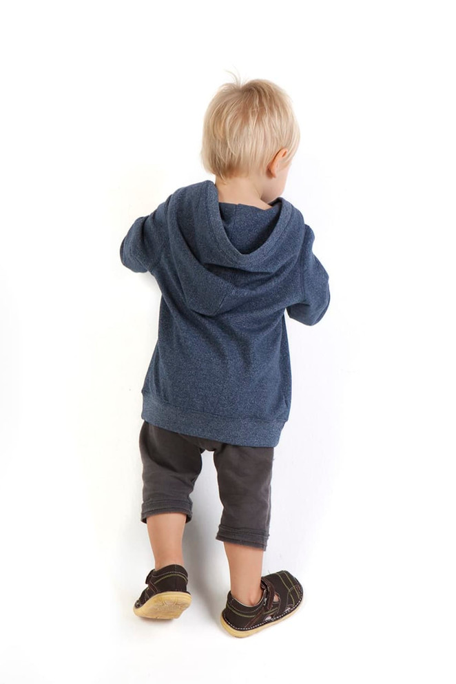 A blue heather hoodie with a hood, worn by a toddler, paired with darker shorts and black sandals.