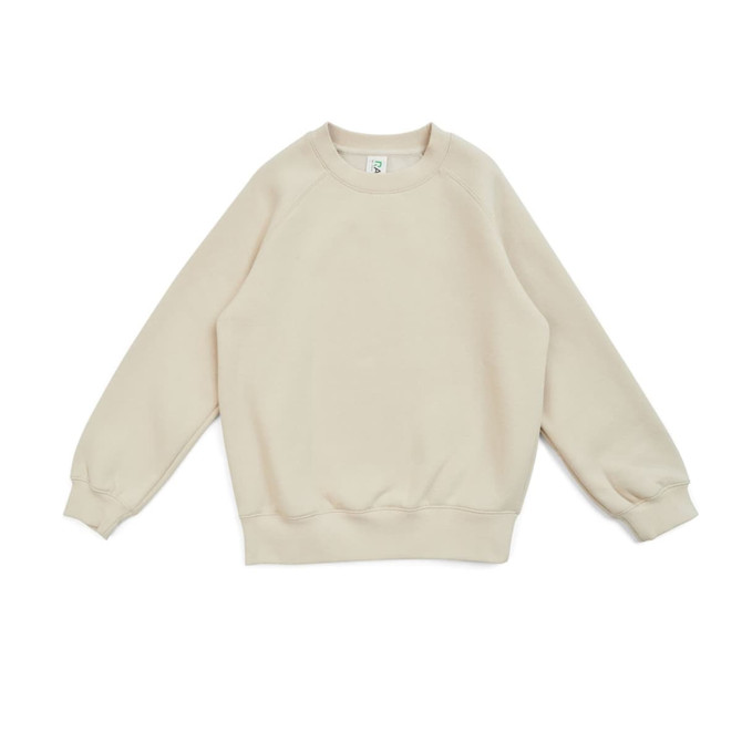 A beige kids' cotton sweatshirt with a classic crew neck and long sleeves. It features a logo on the tag.