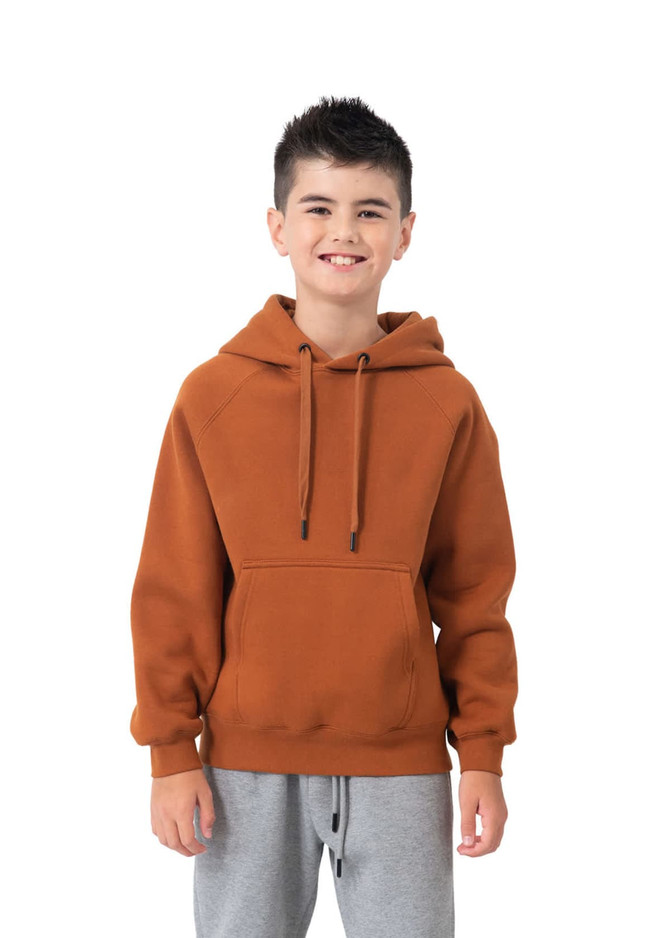 A junior cotton hoodie in a warm brown colour featuring a kangaroo pocket and a hood. The model wears grey pants.