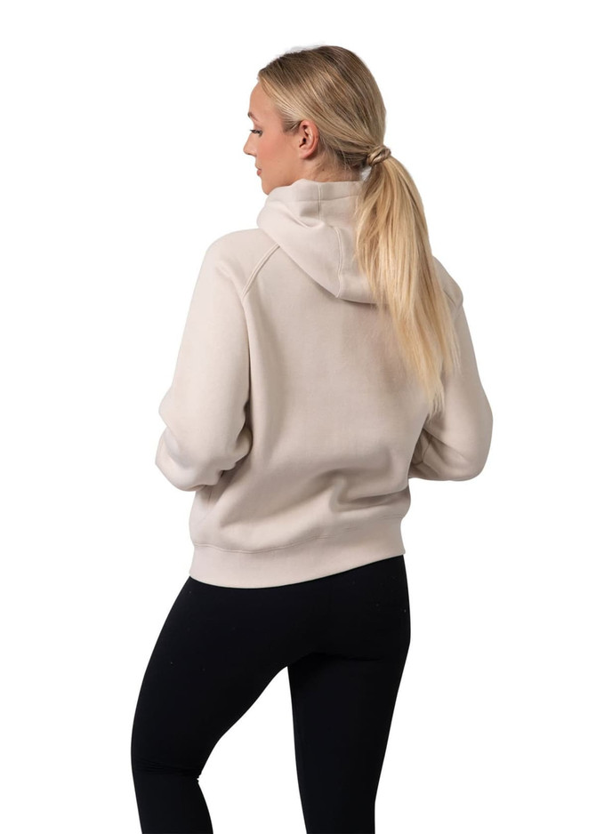 A light beige women's cotton hoodie with a kangaroo pocket and zipper, featuring a logo. Model shown from the back.