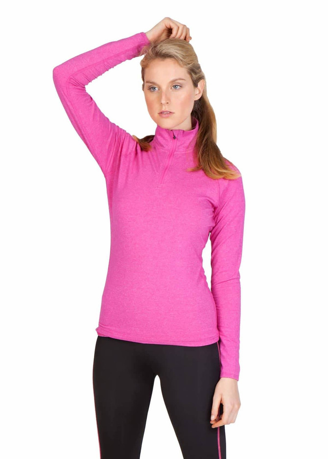 A woman wearing a bright pink half zip mock neck shirt, styled with long sleeves and a fitted look.