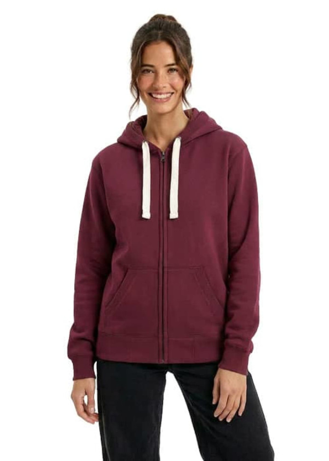 A zip fleece hoodie in burgundy, featuring a hood and contrasting drawstrings, worn by a smiling model.