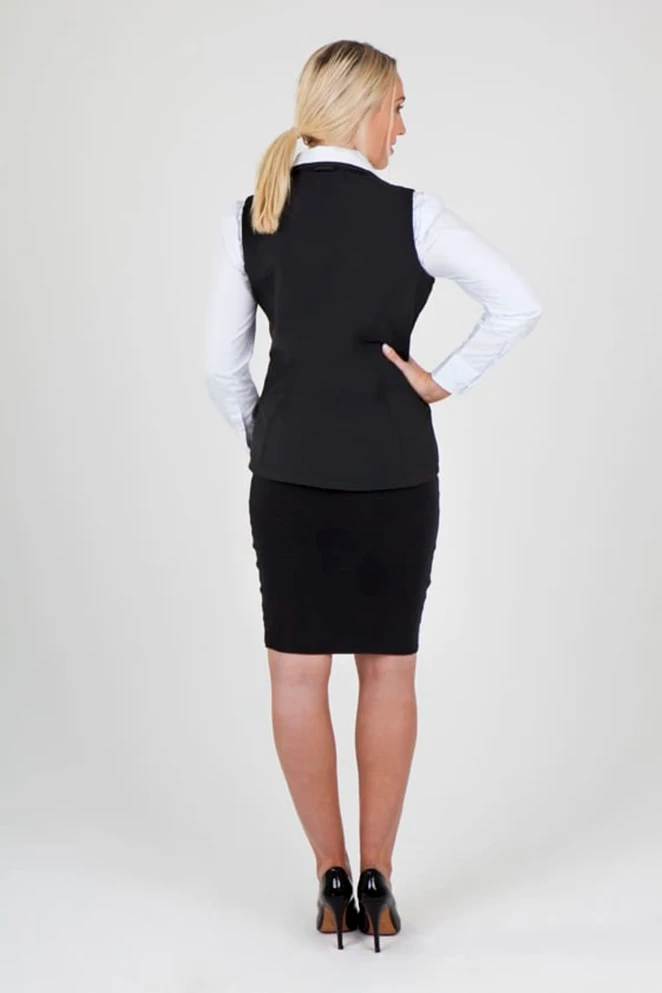 A black women's soft shell vest from the TEMPEST range, viewed from the back, worn over a white shirt.
