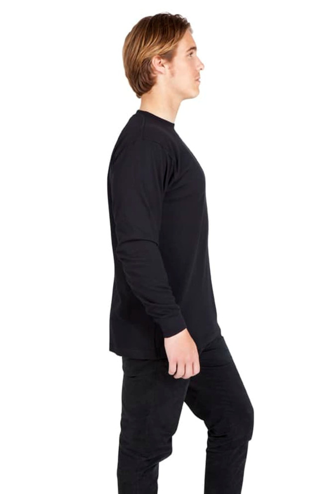 A black long sleeve T-shirt displayed on a model, featuring a simple design and a casual fit.