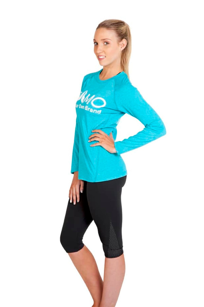 A long-sleeve T-shirt in bright blue worn with black capri leggings. The shirt features a logo on the front.