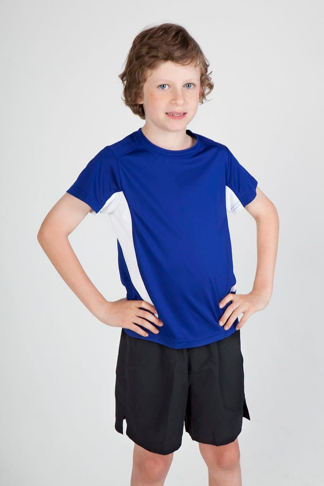 A blue and white Kids Accelerator Cool-Dry T-shirt displayed on a child, paired with black shorts. The shirt features a logo.
