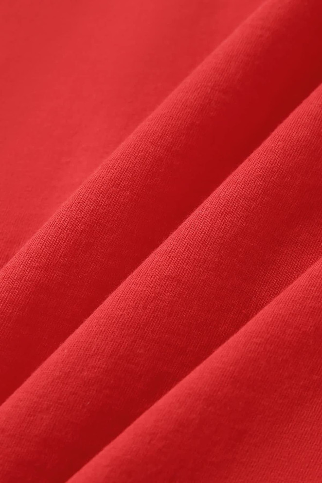 A close-up of a vibrant red fabric, showcasing smooth texture and folds, suitable for a women's singlet.