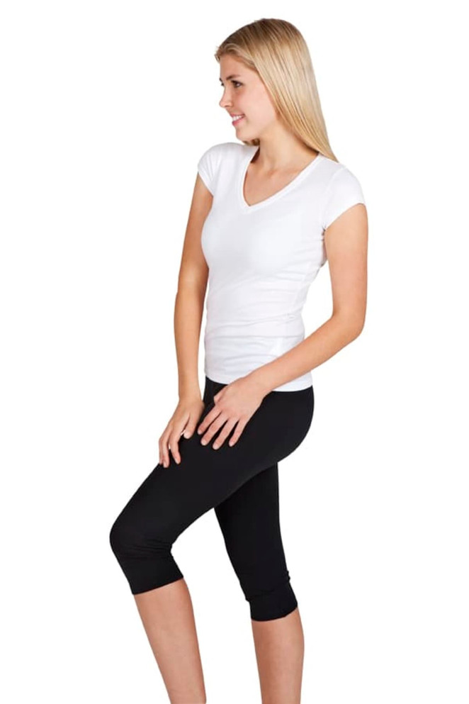 A white women's V-neck T-shirt paired with black leggings. The model is standing sideways, showcasing the shirt.