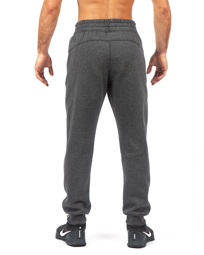 Men's brushed fleece track pants in dark grey, featuring an elasticised waistband and a logo on the back.