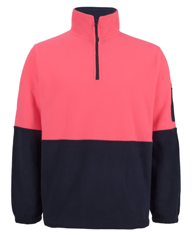 A half-zip polar fleece in coral and navy, featuring a chest pocket and a branded logo on the sleeve.
