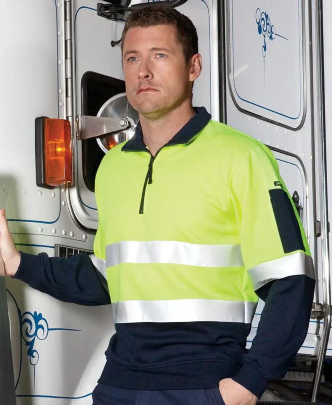A fleecy sweat in fluorescent yellow and navy, featuring a zip neck and reflective stripes. Includes a branding logo.