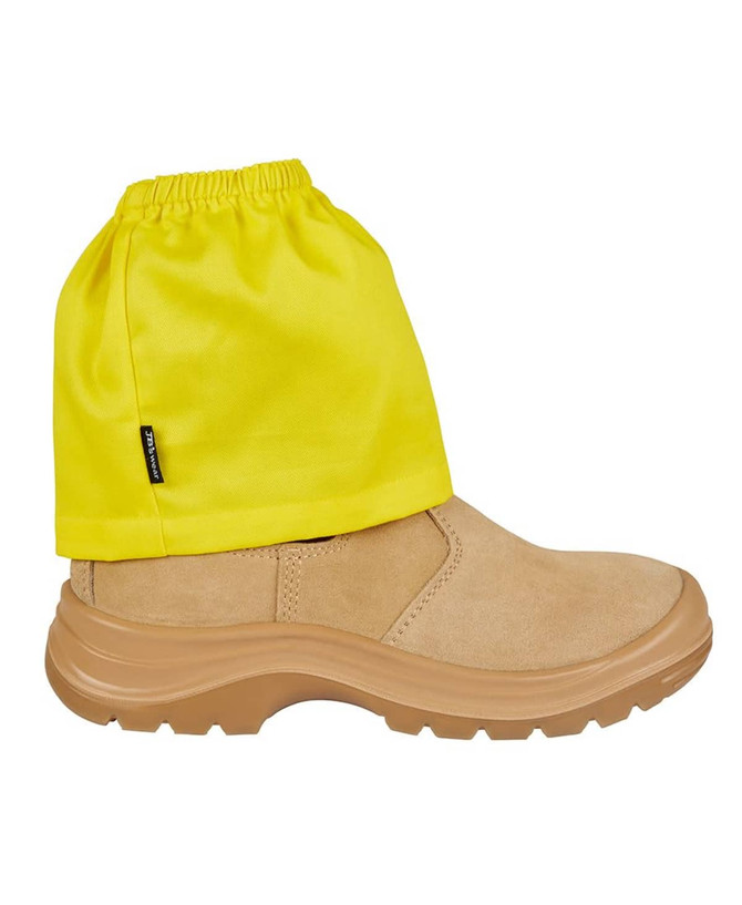 A boot cover in bright yellow fabric, designed to fit over a tan safety boot. It has an elasticated top and a logo.