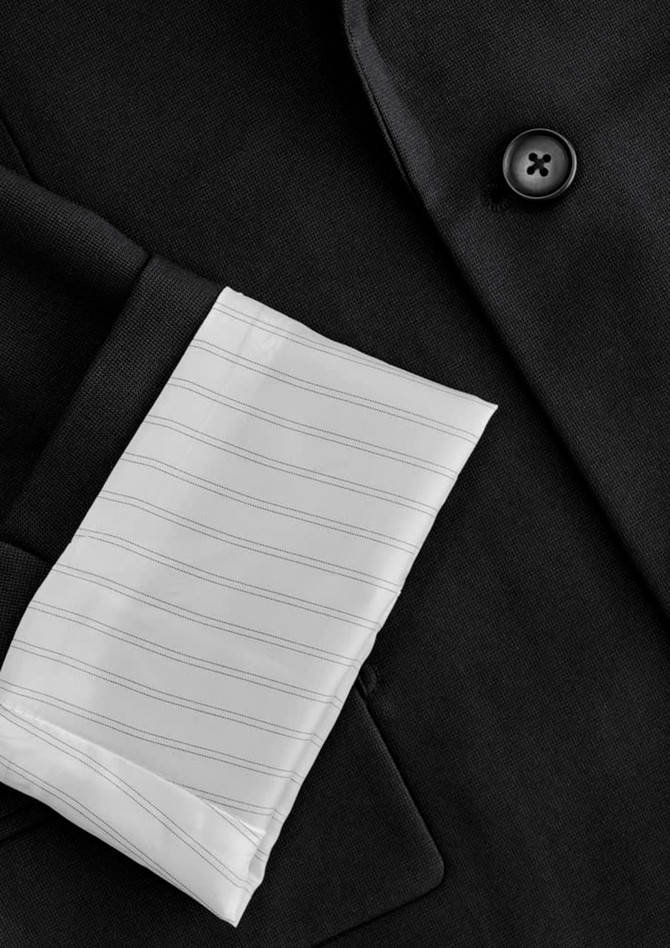 A black jacket featuring a white pinstriped sleeve cuff and a button detail, with a visible brand logo.
