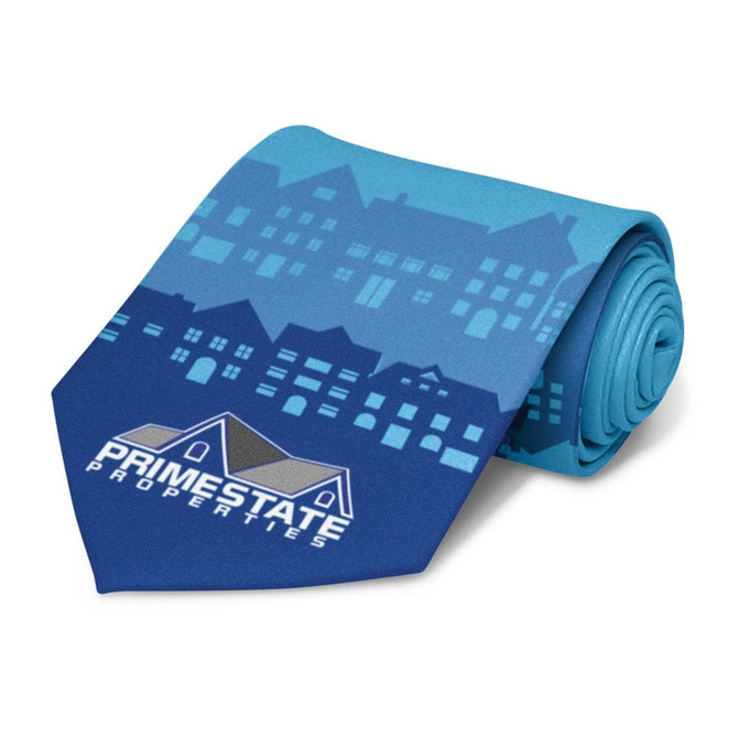 A blue tie featuring a pattern of buildings and a logo, rolled on a white background.