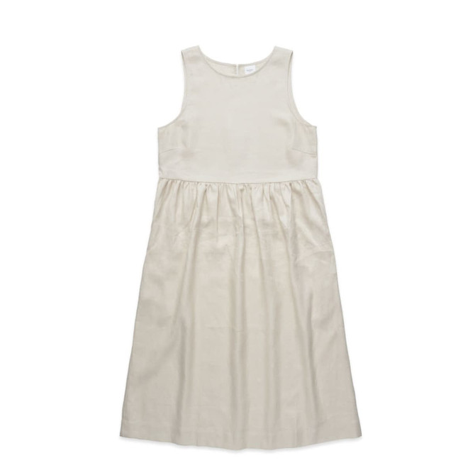 A linen dress in a light beige colour with a sleeveless design and a gathered waistline. It features a simple silhouette.