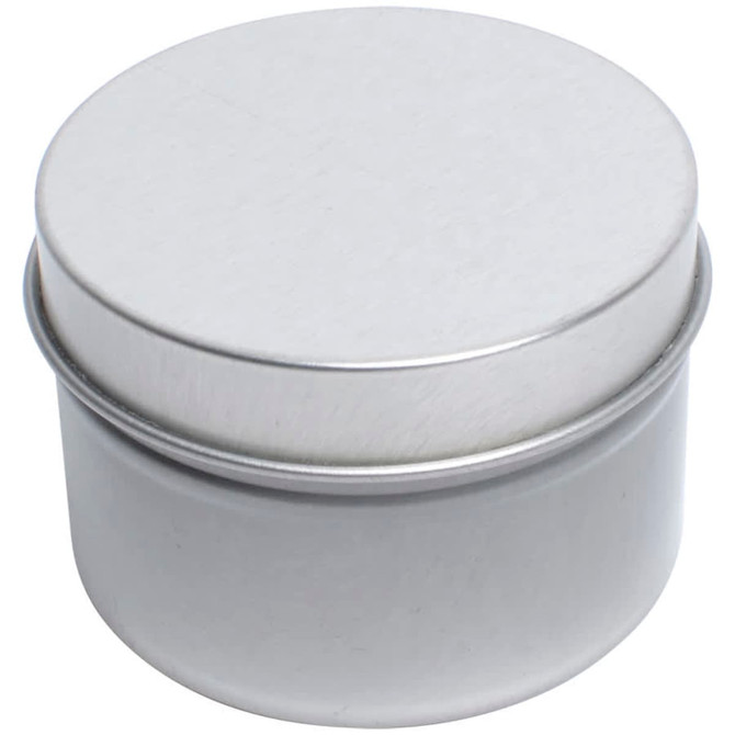 A silver metal tin candle container with a smooth, flat lid.