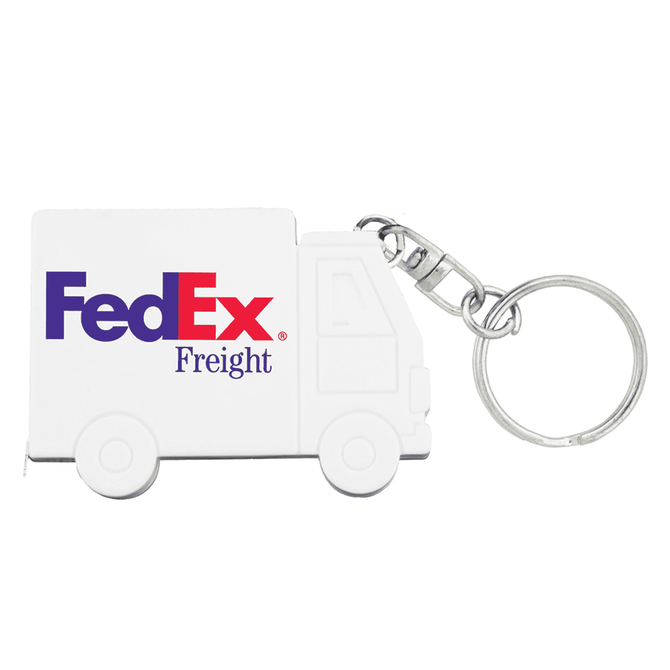 A white truck-shaped keychain with a keyring attachment, featuring a logo.