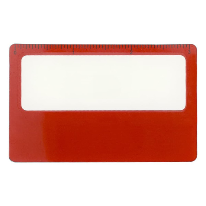A red pocket ruler magnifier with a clear viewing area and a measurement scale on top.
