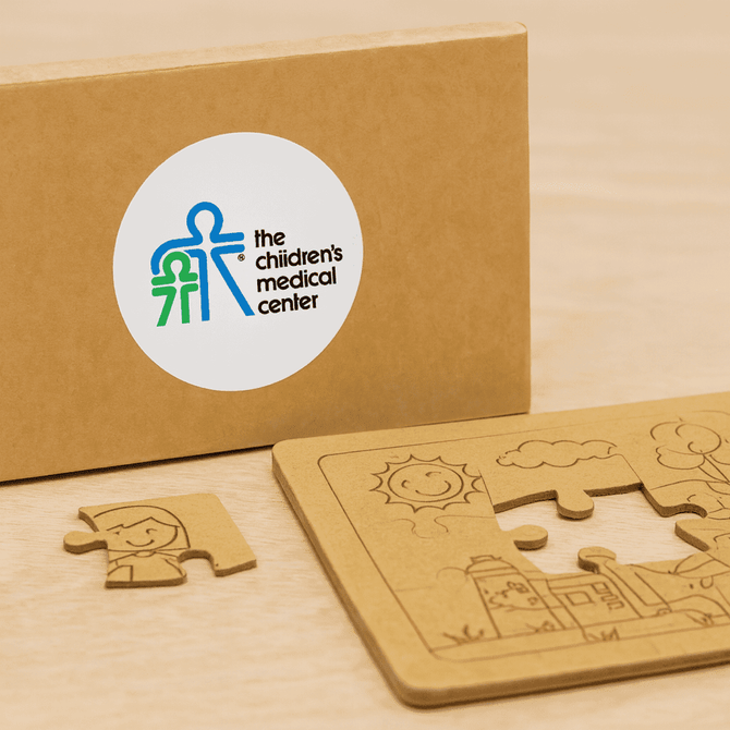 A natural wood jigsaw puzzle set with a puzzle piece and a brown box featuring a logo.