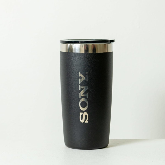 A drink bottle in black with a stainless steel lid and a logo displayed on the side.