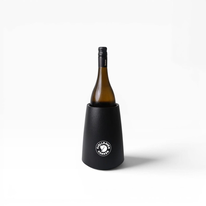 A black wine cooler holds a bottle of wine, featuring a circular logo on the front.
